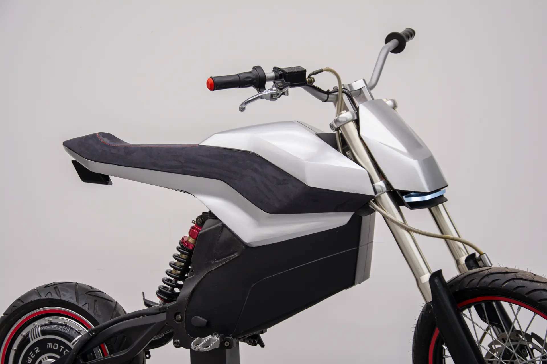 Side detail of the E-moto seat, bodywork and front fairing